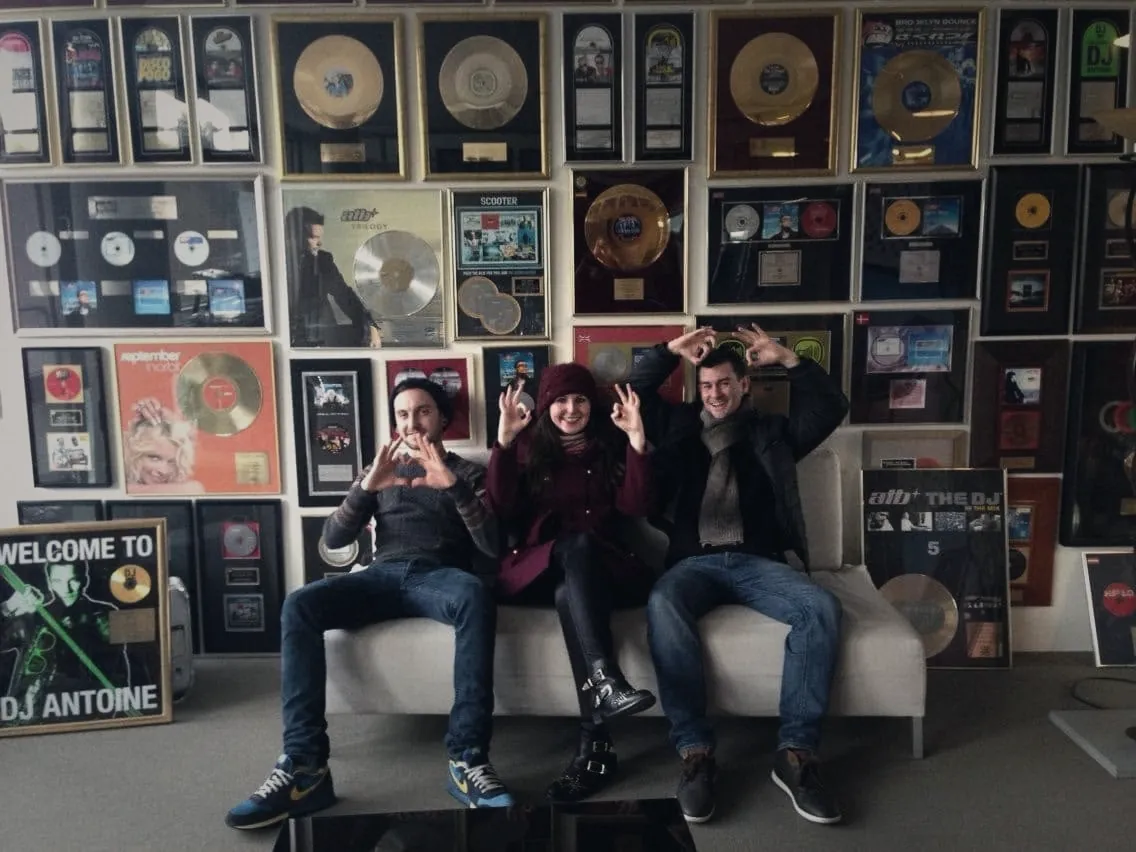 Christian Rodwell, right, in front of the Cr2 Records gold disc wall